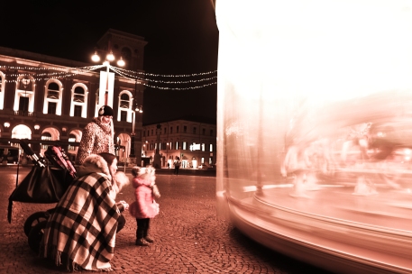 This little girl was absolutely captivated by this ride in Piazza Saffi